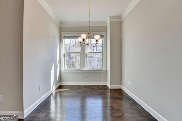 unfurnished dining area with baseboards, a notable chandelier, dark wood finished floors, and crown molding