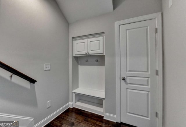 mudroom with dark wood-type flooring and baseboards