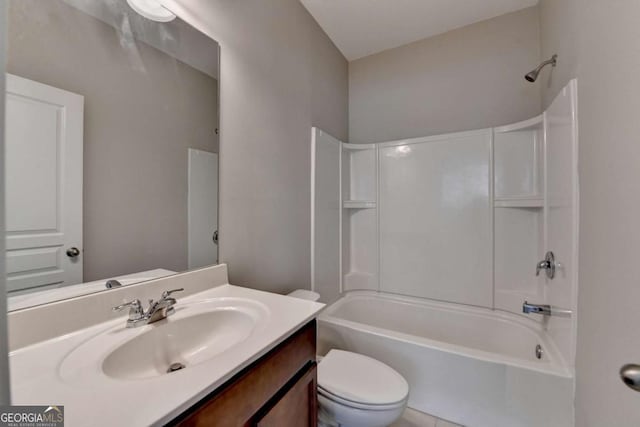 bathroom featuring vanity, bathing tub / shower combination, and toilet