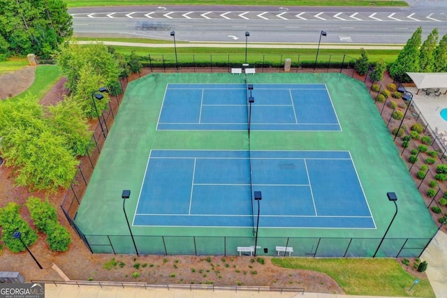 view of sport court featuring fence