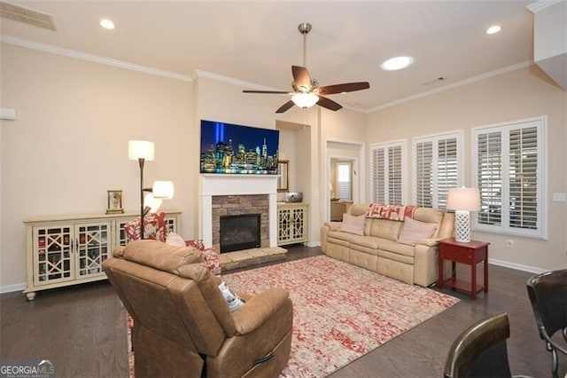 living room featuring baseboards, a ceiling fan, and crown molding