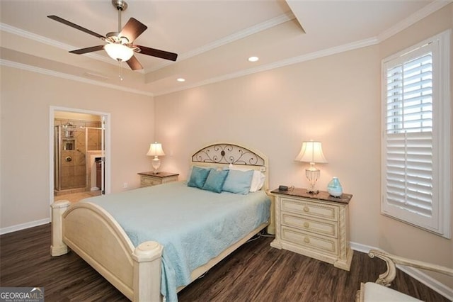 bedroom featuring dark wood finished floors, a tray ceiling, and crown molding