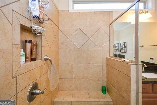 bathroom featuring vanity and a tile shower