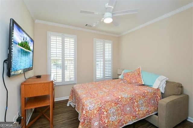 bedroom featuring dark wood finished floors, crown molding, baseboards, and ceiling fan