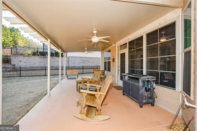 view of patio / terrace featuring a ceiling fan and fence