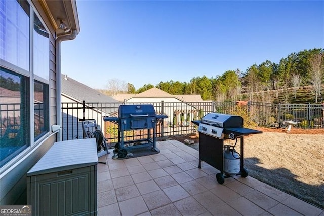 view of patio / terrace featuring area for grilling and fence