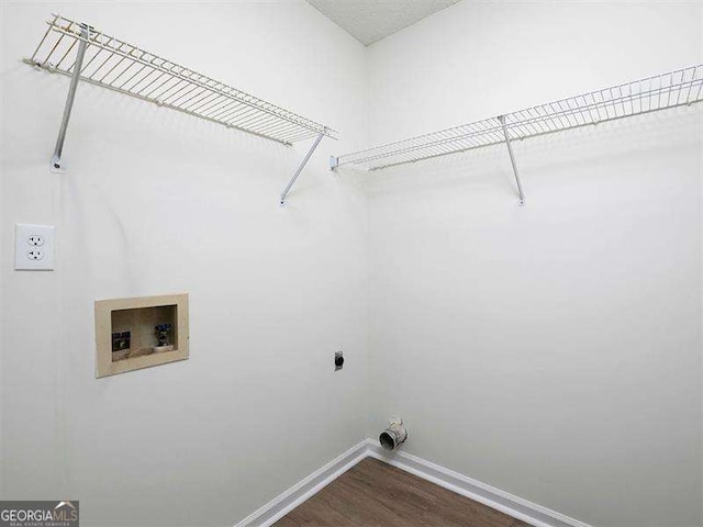 laundry area featuring baseboards, washer hookup, laundry area, hookup for an electric dryer, and dark wood-style flooring