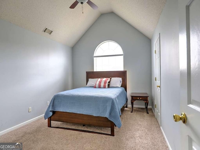 bedroom featuring baseboards, visible vents, lofted ceiling, a textured ceiling, and light colored carpet