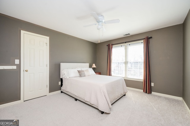 bedroom with light colored carpet, baseboards, and visible vents