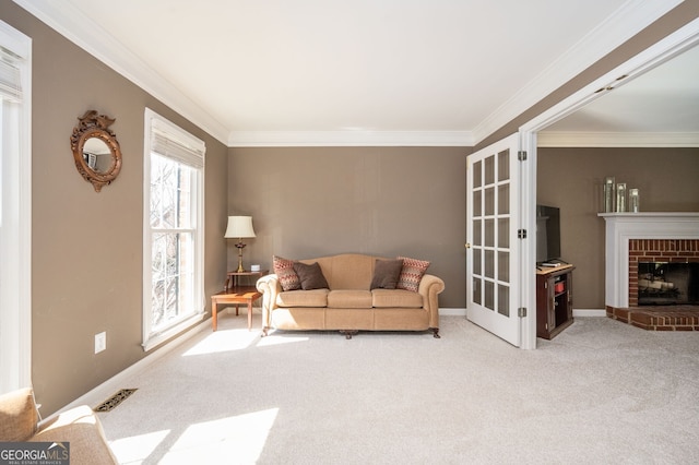 carpeted living room with visible vents, baseboards, a fireplace, and crown molding