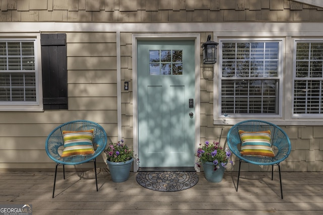 doorway to property with a deck