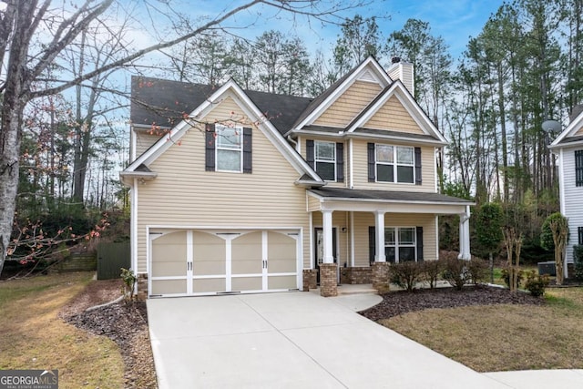 craftsman-style house with concrete driveway, an attached garage, a porch, and a chimney