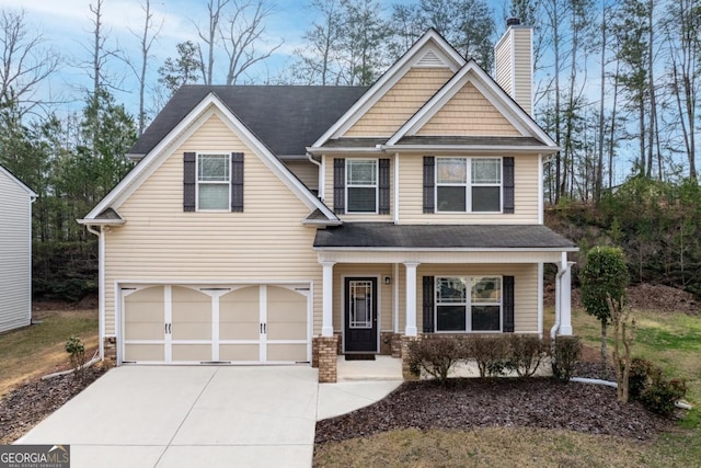 craftsman-style home featuring a porch, concrete driveway, a garage, and a chimney