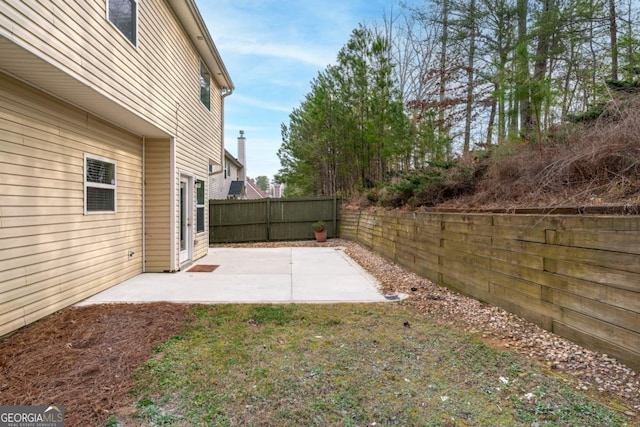 view of yard with a patio and fence