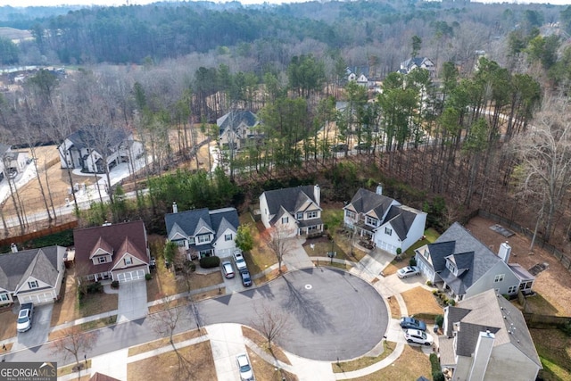 bird's eye view with a residential view and a wooded view