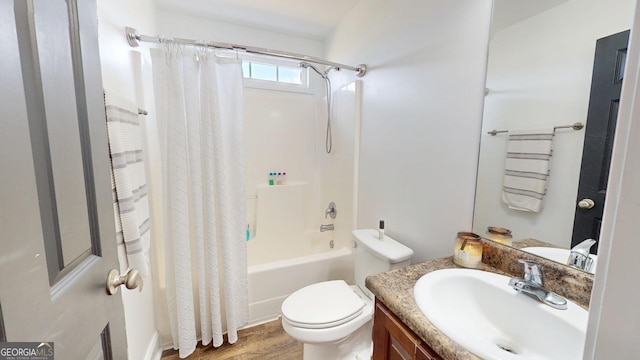 full bathroom with toilet, wood finished floors, vanity, and shower / bath combination with curtain