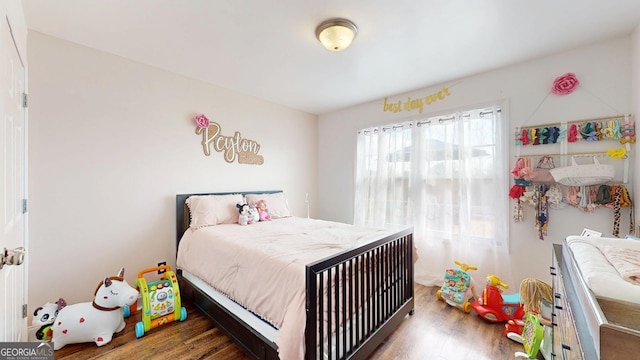 bedroom with wood finished floors