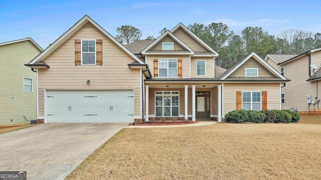 craftsman inspired home with driveway, a front lawn, a garage, and a shingled roof