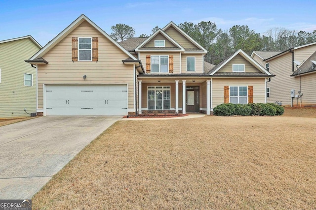 craftsman inspired home featuring a front lawn, concrete driveway, and an attached garage