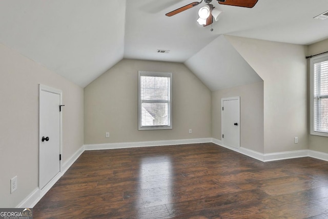 bonus room with plenty of natural light, wood finished floors, and a ceiling fan