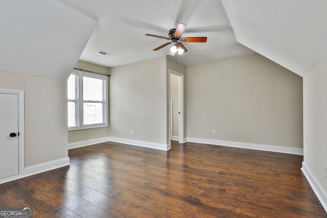 bonus room with wood finished floors, baseboards, visible vents, ceiling fan, and vaulted ceiling