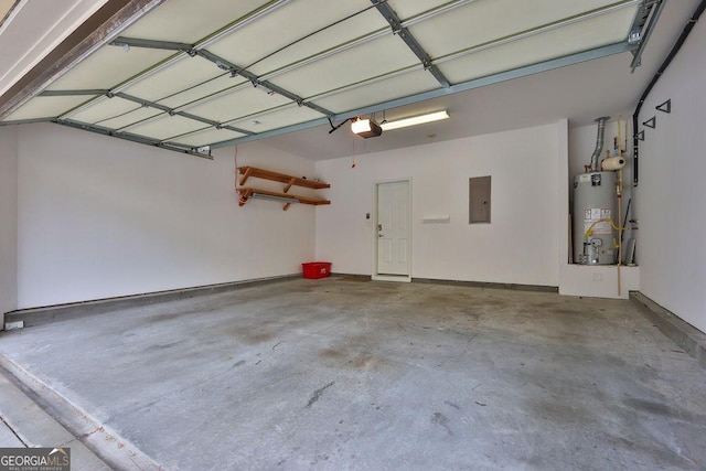 garage with electric panel, a garage door opener, and water heater