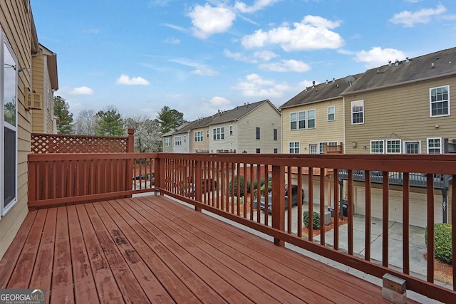 wooden deck featuring a residential view
