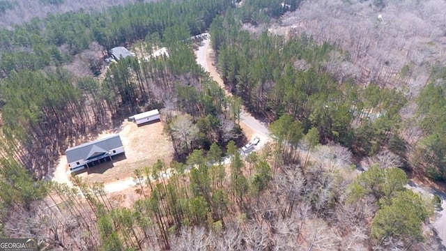 aerial view featuring a view of trees