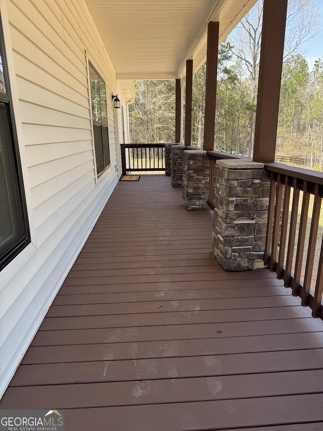 wooden terrace featuring a porch