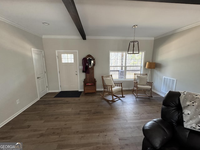 entryway featuring visible vents, baseboards, ornamental molding, beam ceiling, and dark wood-style flooring