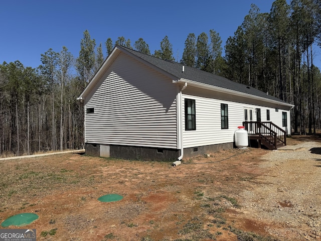 view of side of property featuring crawl space