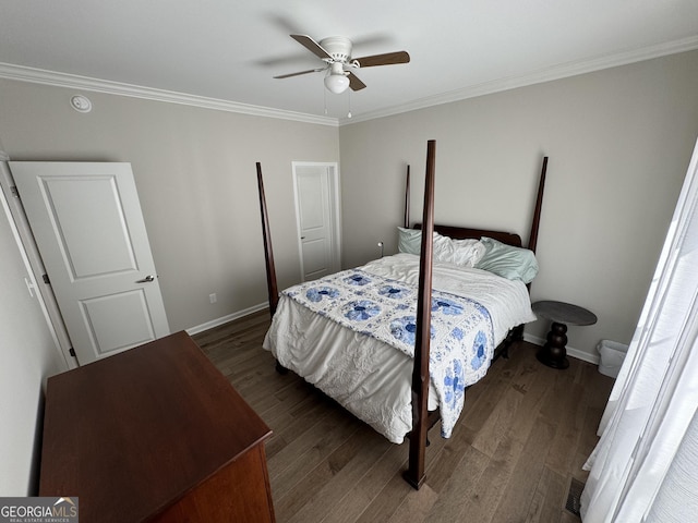 bedroom with baseboards, wood finished floors, and crown molding