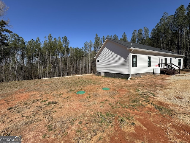 view of side of property featuring crawl space