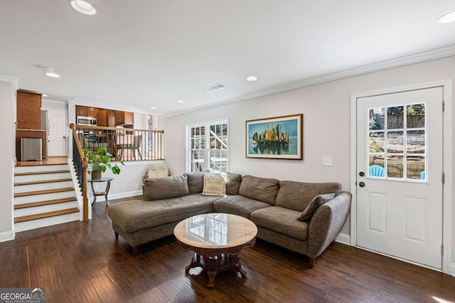 living area with stairs, crown molding, recessed lighting, and wood finished floors