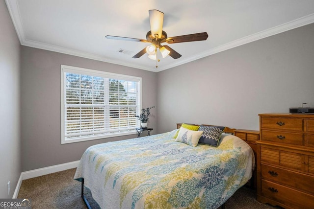 bedroom with visible vents, crown molding, baseboards, carpet floors, and a ceiling fan