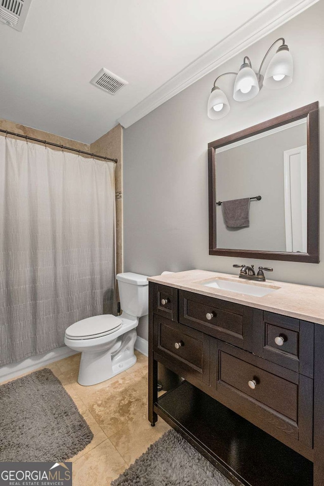 bathroom featuring vanity, toilet, visible vents, and ornamental molding