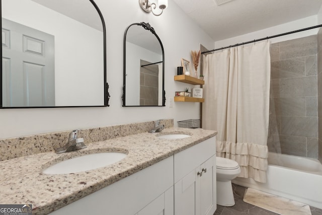 bathroom featuring a sink, toilet, shower / bath combo, and double vanity