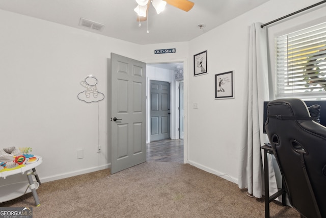 rec room with visible vents, baseboards, carpet, and ceiling fan