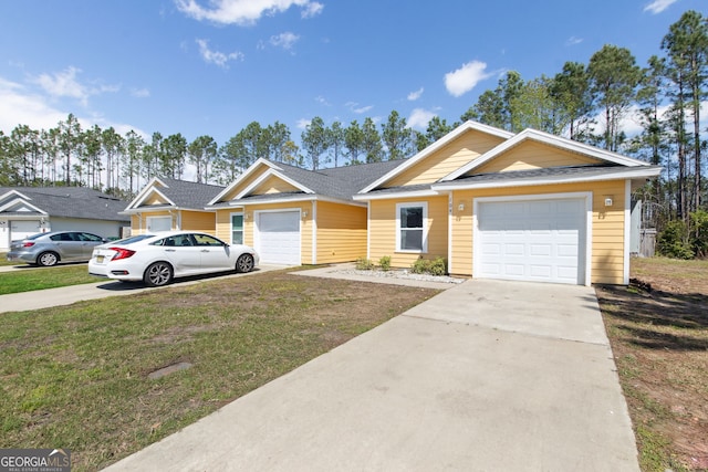 ranch-style house featuring a garage, concrete driveway, a front yard, and a shingled roof