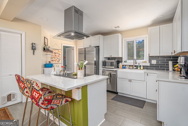 kitchen with visible vents, tasteful backsplash, extractor fan, and appliances with stainless steel finishes