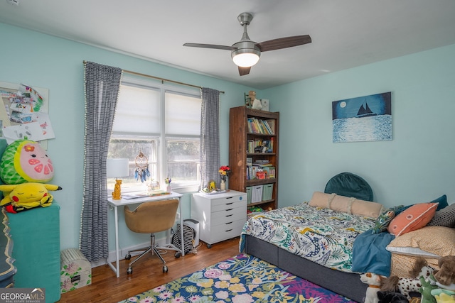 bedroom with wood finished floors and ceiling fan