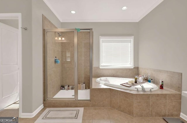 full bathroom with a garden tub, baseboards, a stall shower, ornamental molding, and tile patterned floors