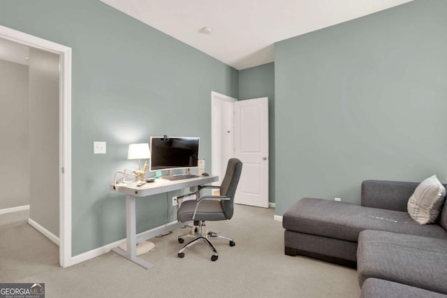 carpeted office with baseboards