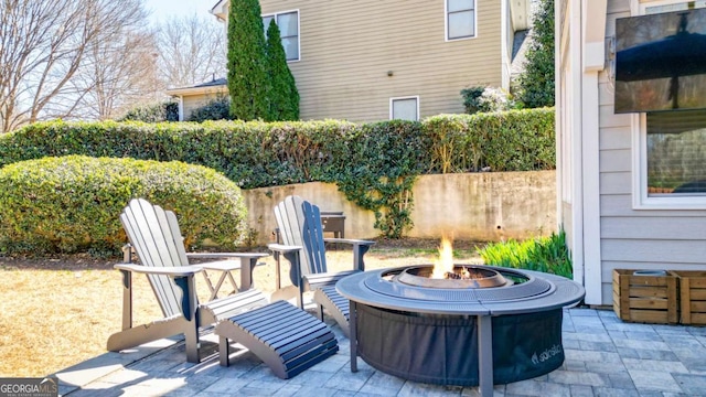 view of patio / terrace with an outdoor fire pit