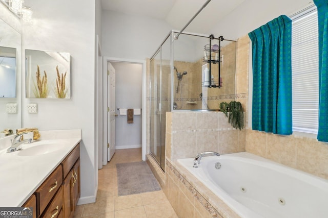 full bathroom with vanity, baseboards, a stall shower, a whirlpool tub, and tile patterned flooring