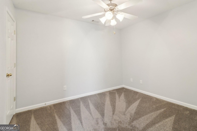 empty room with visible vents, ceiling fan, baseboards, and carpet