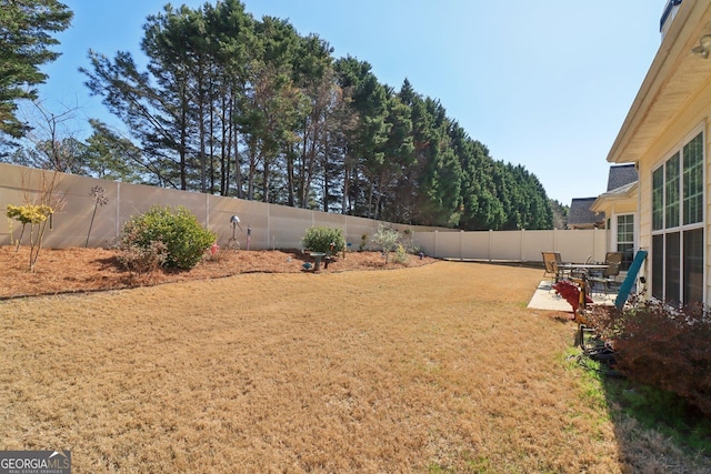 view of yard featuring a fenced backyard and a patio