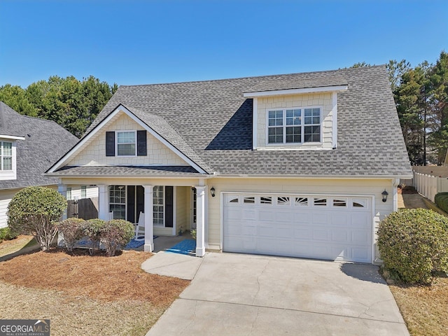 view of front facade featuring a porch, fence, driveway, and roof with shingles