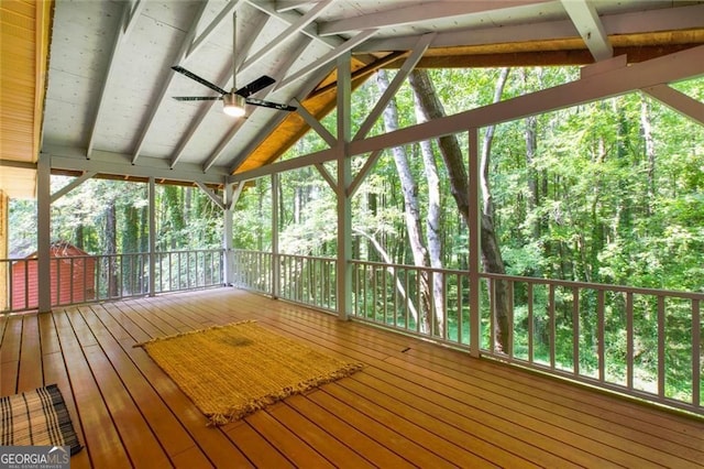 wooden deck with a ceiling fan