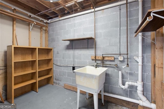 unfinished basement with concrete block wall